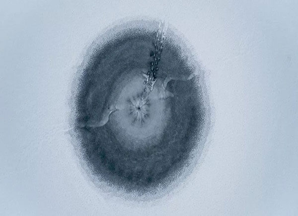 Aerial Photography of Hole In Frozen lake